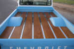 13 1965 Chevy C10 bed with polished wood planks and chrome strips