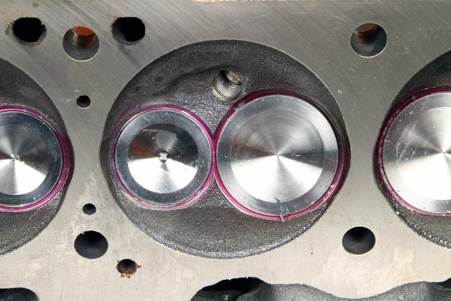 13 Close up of fresh valve job on Mopar 340 head with lapped intake and exhaust valves