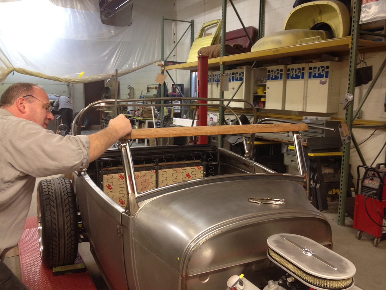 13 Early Ford roadster body with chrome frame and wood header starting mock up for convertible top fabrication