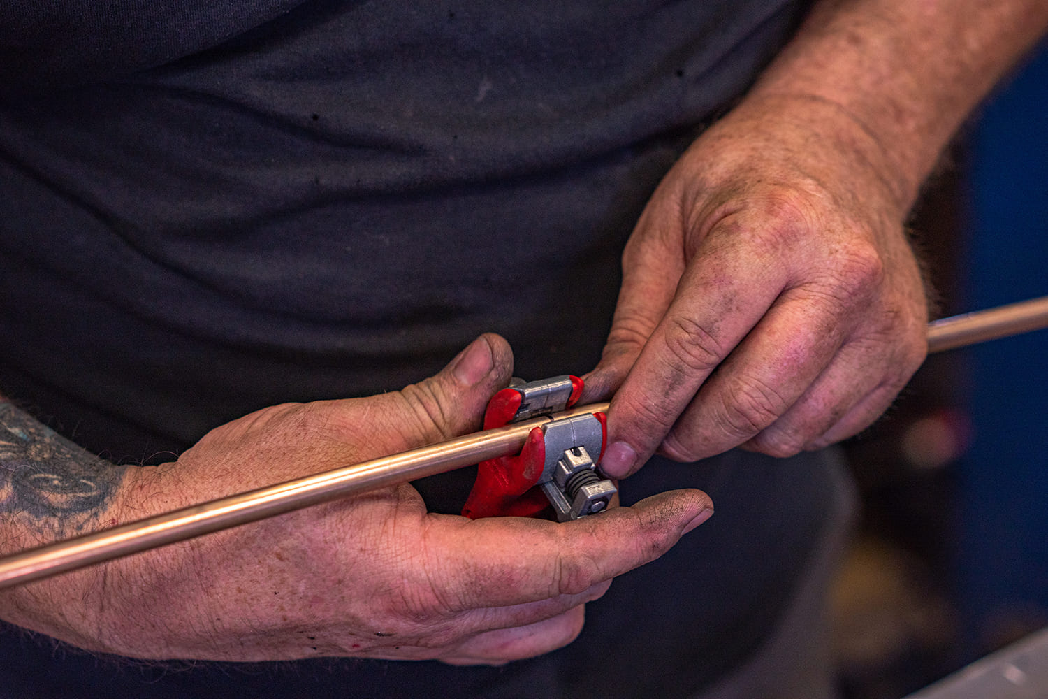 15 Cutting copper hard line with tubing cutter during custom air line fab for AccuAir setup