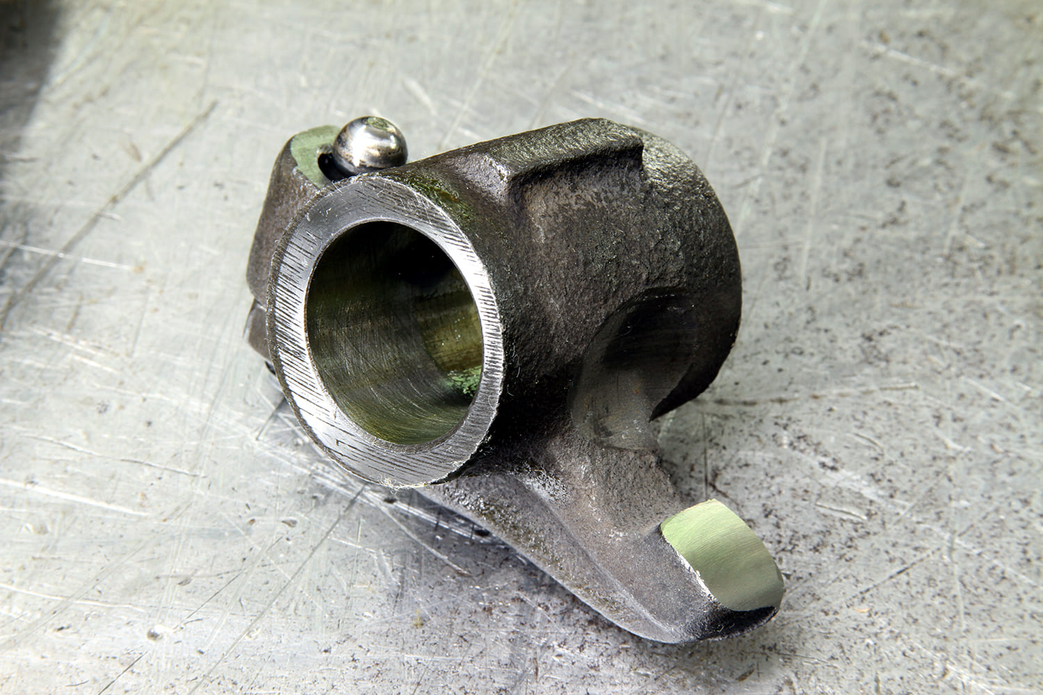 15 Individual Mopar small block rocker arm shows wear pattern and oil feed groove