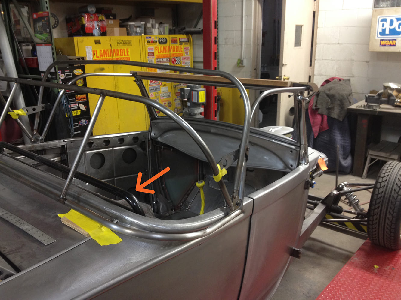 15 Rear framework view of roadster top in progress highlighting reinforcement and tube bracing