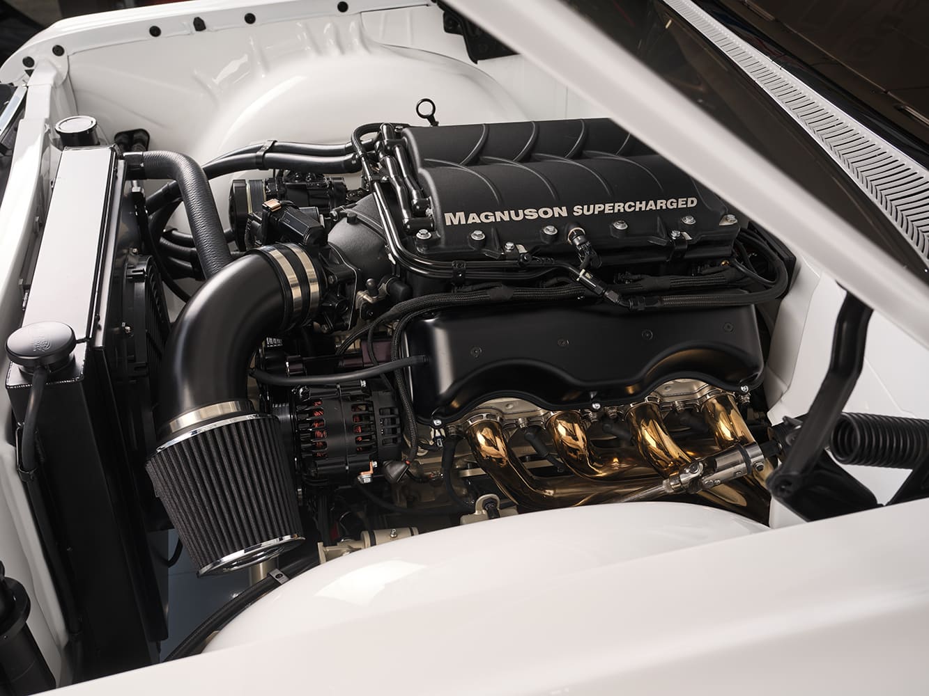 15 Side angle showing 1959 Impala’s cold air intake and Magnuson supercharger tucked cleanly in the bay