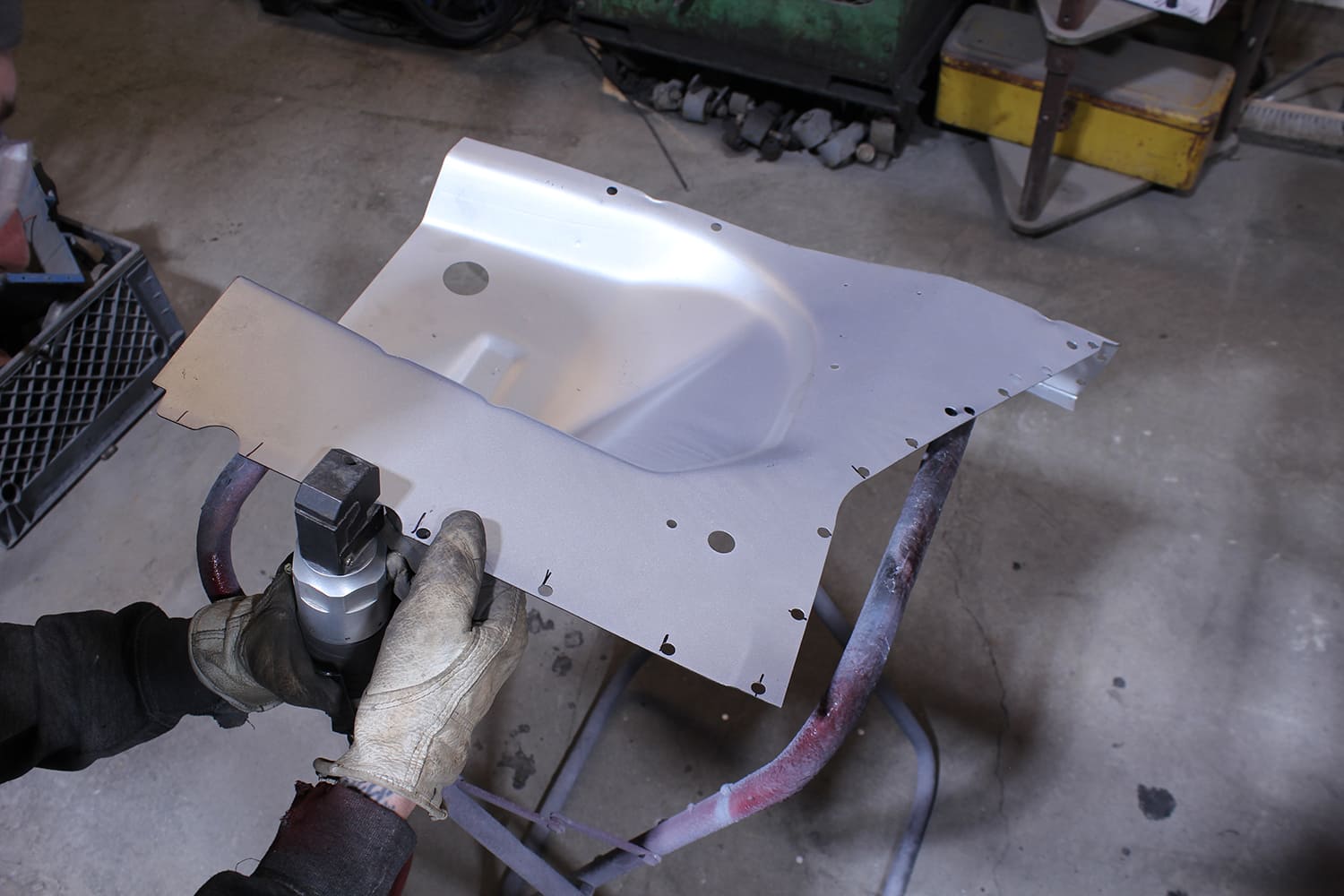 15 Using pneumatic hole punch to prep new Mustang apron panel for plug welds