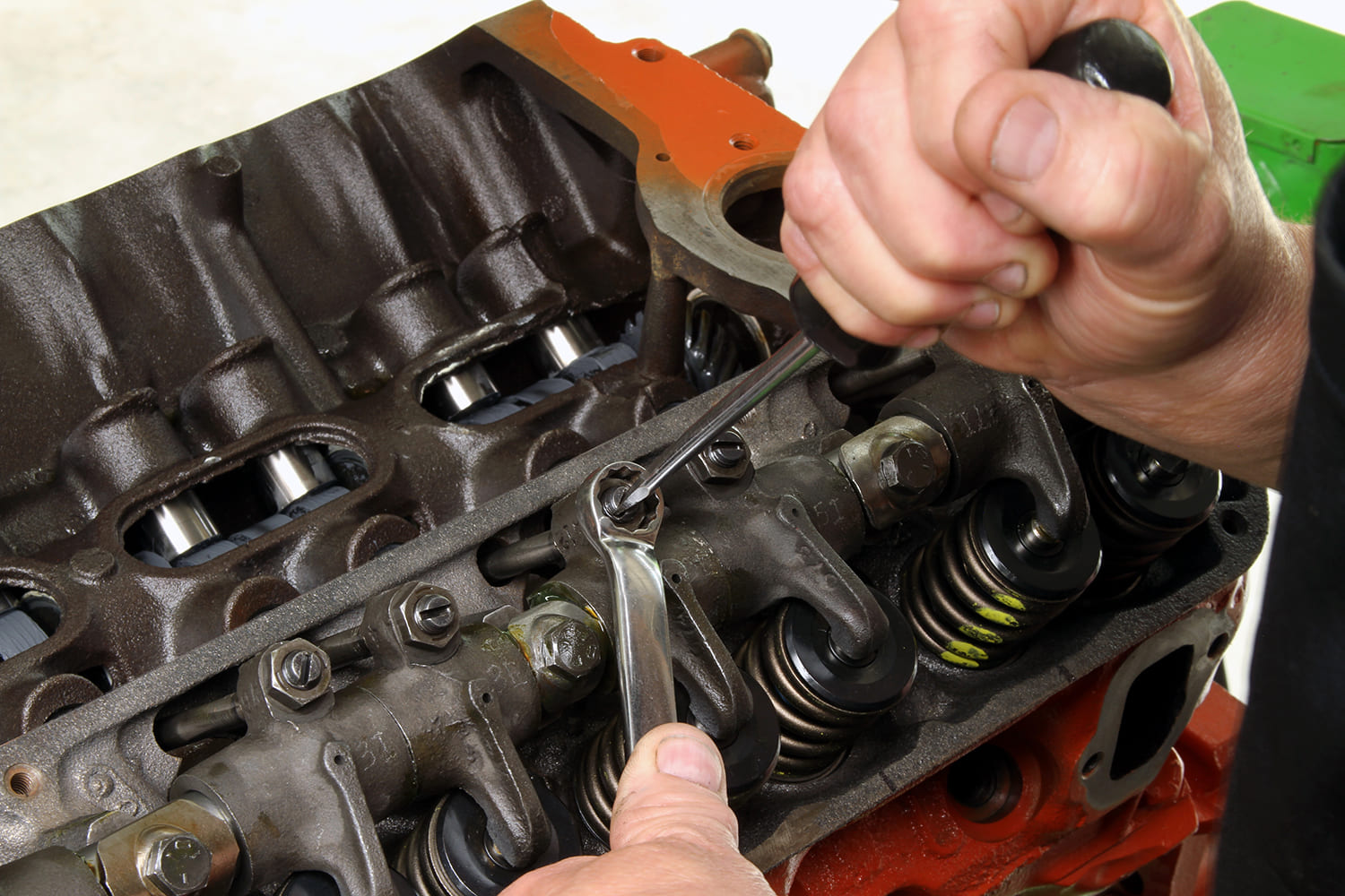 16 Adjusting valve lash on the Mopar 340 rocker assembly during final engine setup