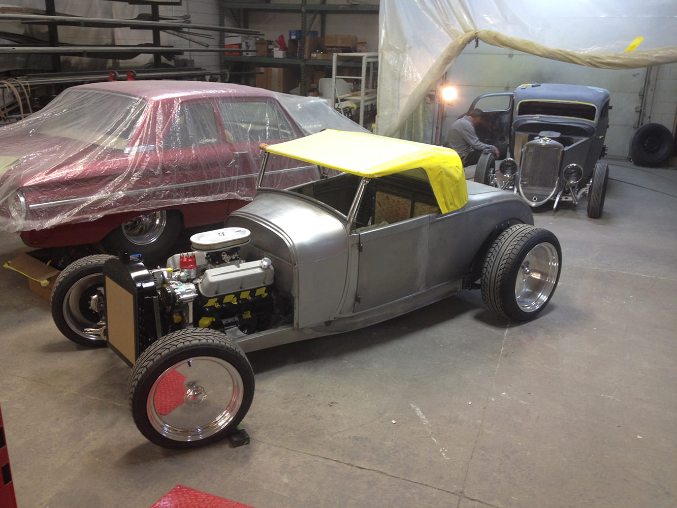 16 Yellow vinyl mock up on highboy roadster taped down for shaping custom top profile