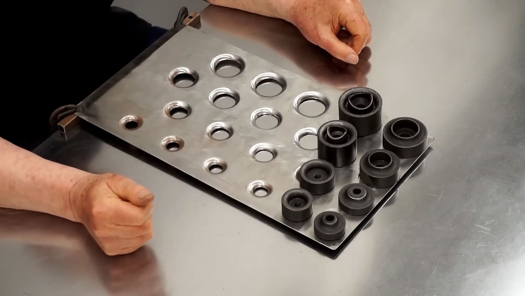17 Large sheet of aluminum with multiple formed dimples and corresponding dimple dies