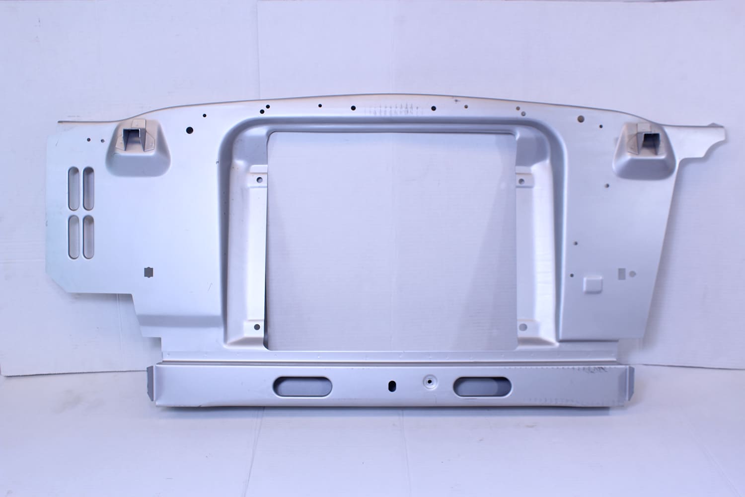 17 Replacement Mustang radiator core support panel shown in e coated steel before fitment