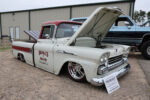 18 1959 Chevrolet Apache Fleetside rocking shop truck style with red accents and staggered polished wheels