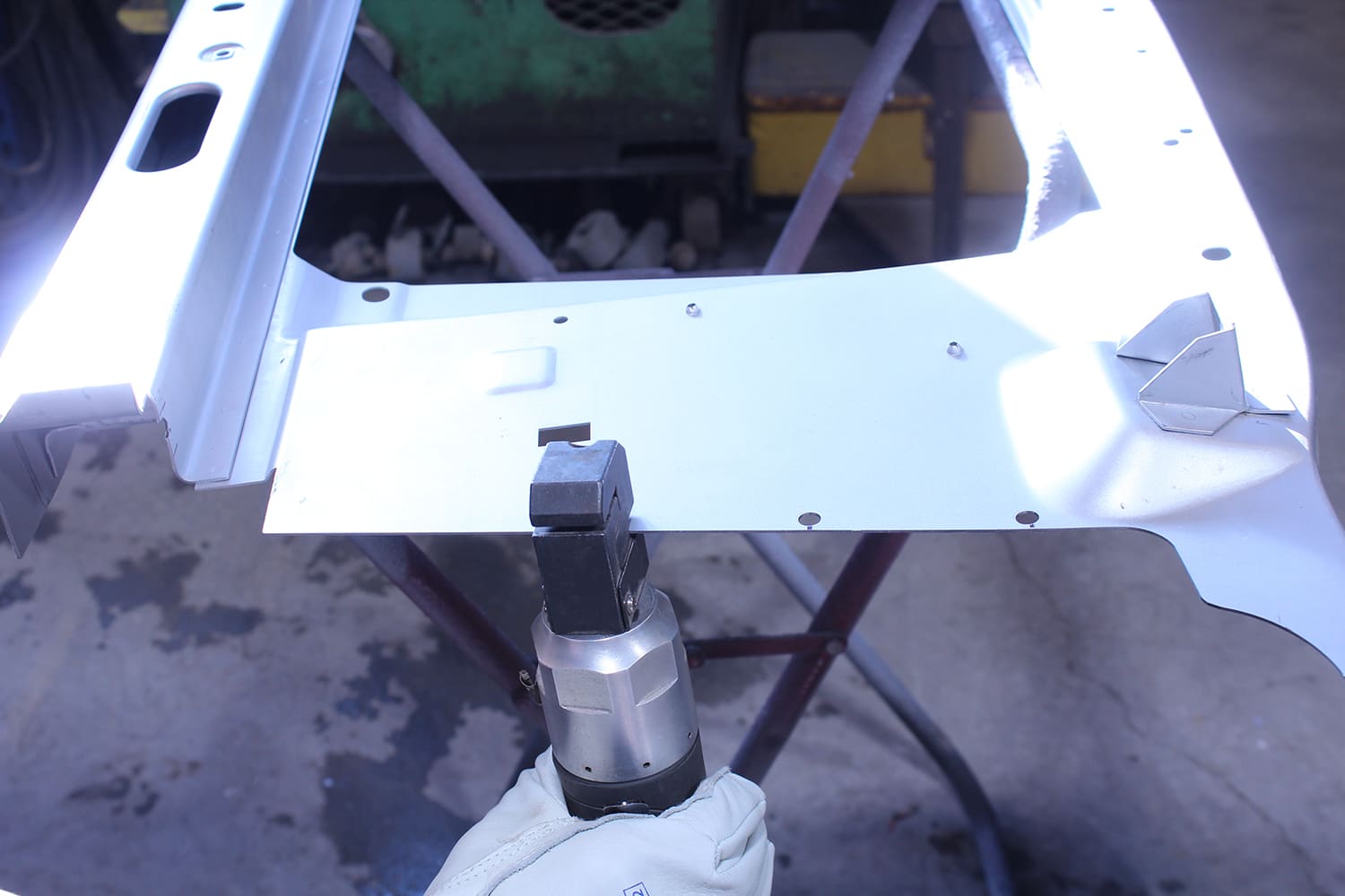 18 Air punch used to perforate radiator support flange for welding on 1965 66 Mustang