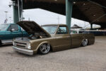 19 1967 Chevrolet C10 in metallic olive green with detailed bumper etching and tucked staggered billets