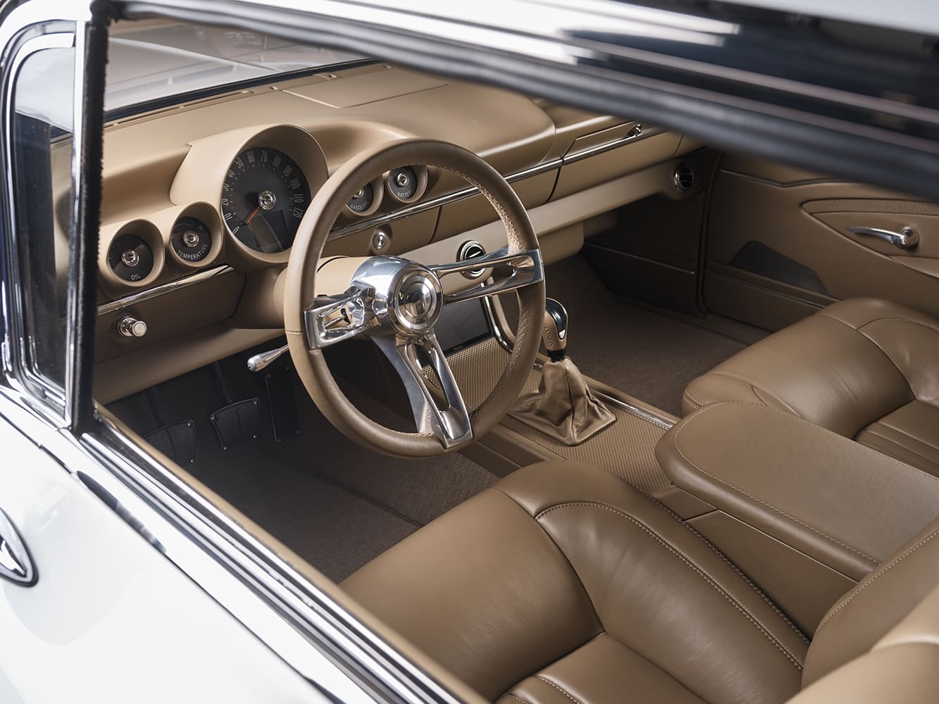 19 Driver’s view of 1959 Impala showing retro modern gauge cluster custom steering wheel and tan wrap