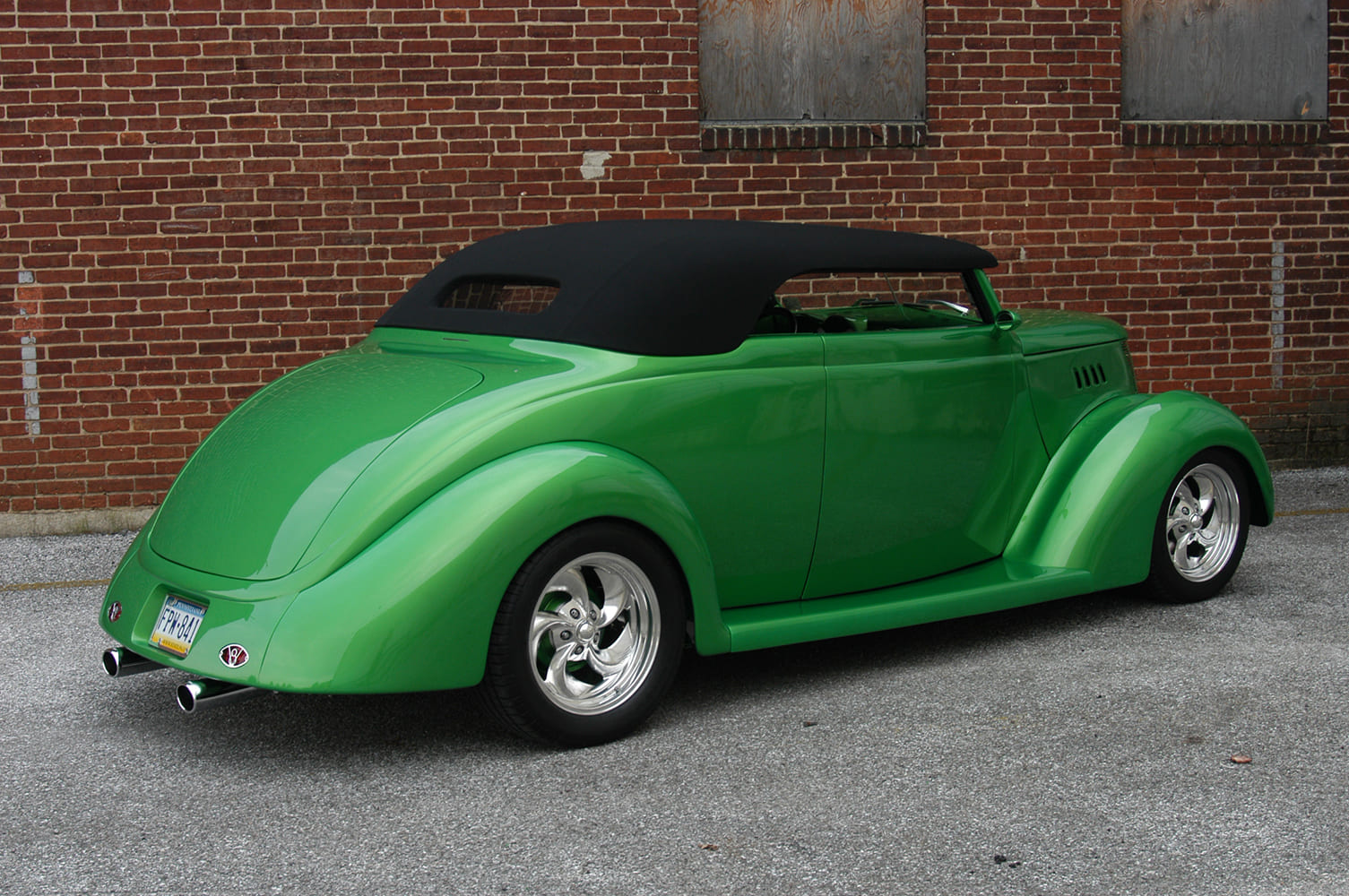 20 1937 Ford Roadster with black cloth top frenched rear pan and billet five spokes in candy green