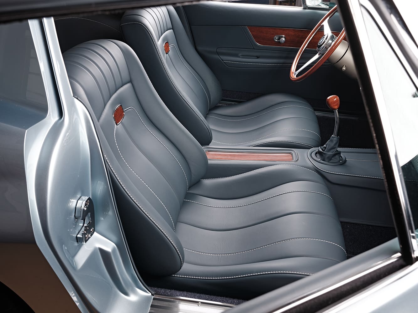 20 1963 Corvette leather bucket seats custom upholstery wood inserts restomod design silver blue interior