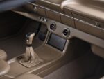 20 Detailed shot of center console with touchscreen billet knobs and modern shifter in 1959 Impala