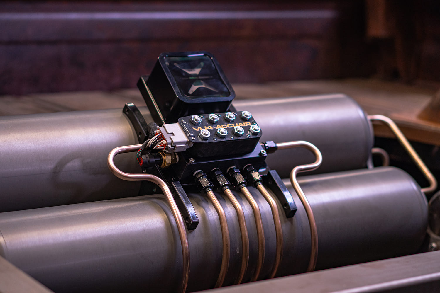 21 Final VU4 by AccuAir setup mounted between dual air tanks with hard lines fully routed