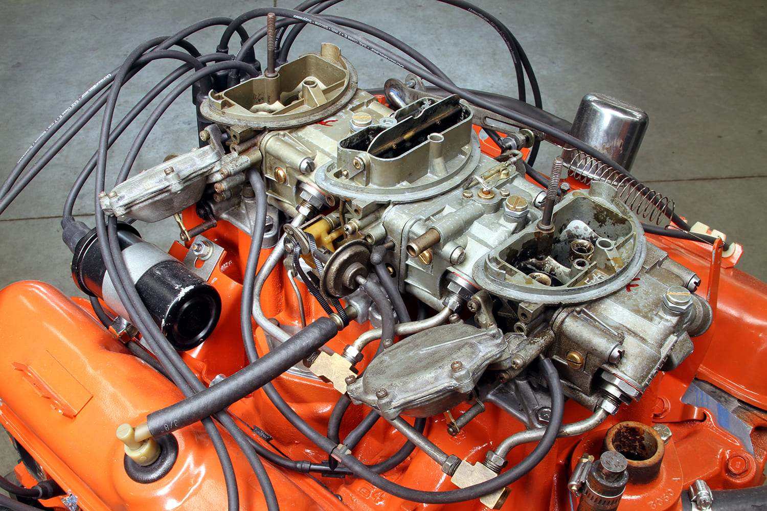 21 Fully assembled Mopar 340 Six Pack induction setup with vacuum pods and fuel lines