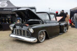 22 1956 Chevrolet 3100 Task Force in gloss black with chrome bumpers tucked billet wheels and smoothed hood