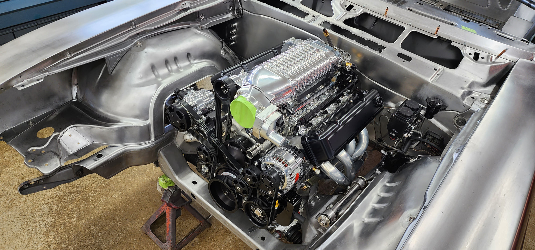 22 1969 Camaro fitted with polished supercharged LS engine and custom serpentine drive