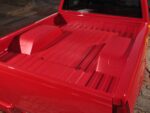22 1996 Chevy truck bed features a smoothed and painted sheet metal tub and notch cover