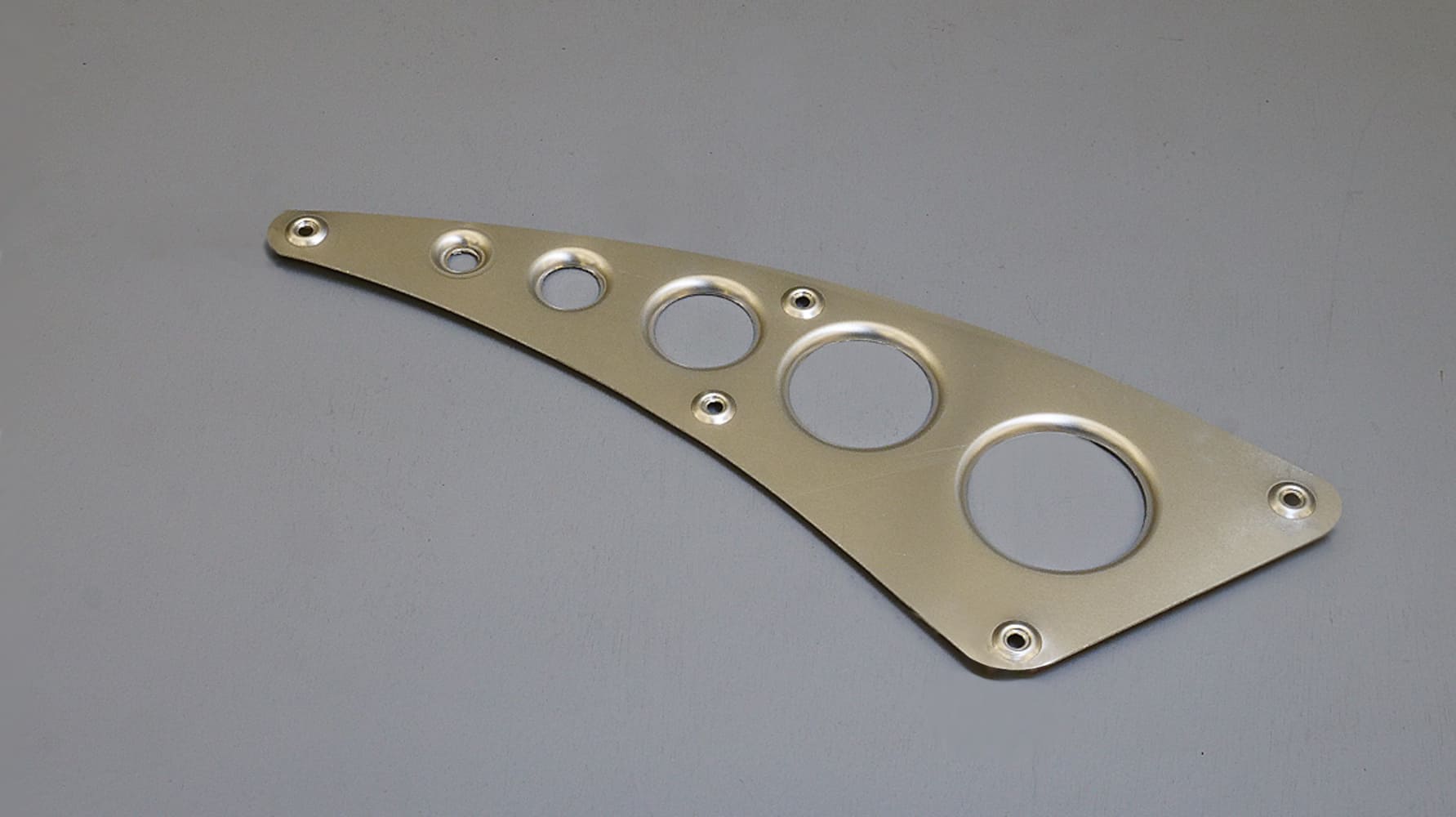 22 Precision cut and dimpled aluminum bracket designed for strength and reduced weight