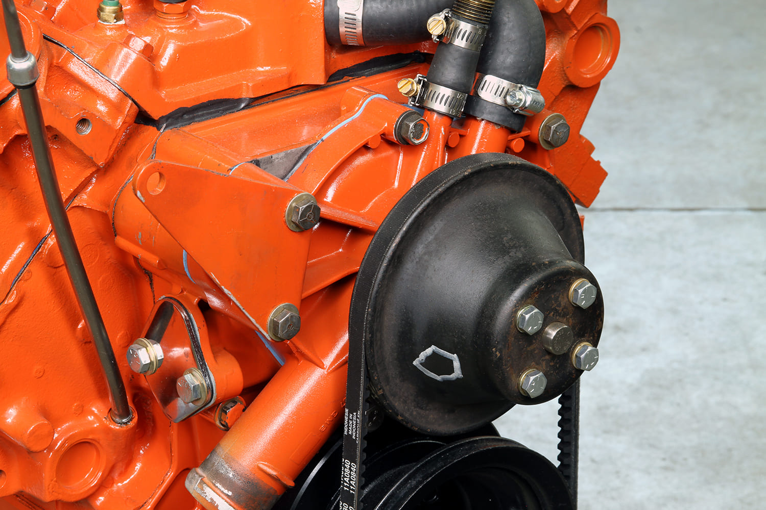 23 Timing cover and accessory bracketry installed on front of Mopar 340 engine