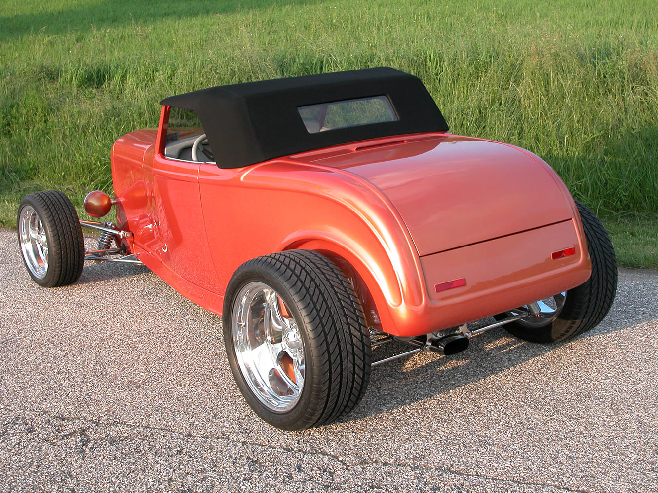 24 1932 Roadster showcasing clean tail section and black canvas top