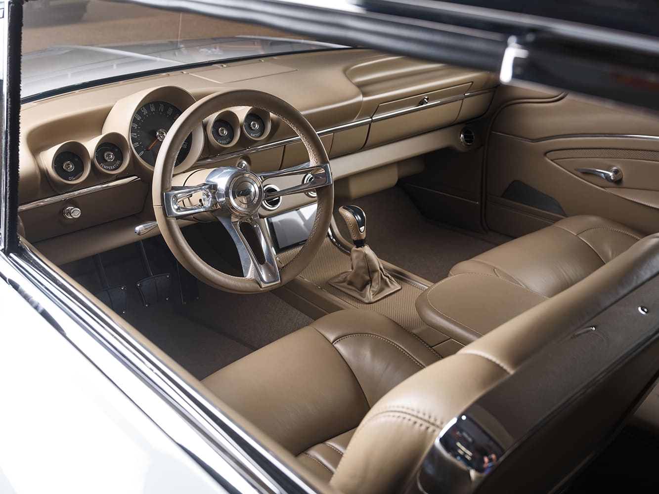 24 Full dash view of 1959 Impala interior with billet steering wheel analog gauges and custom stitched leather
