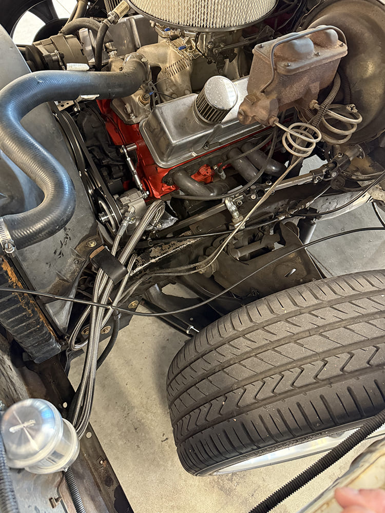 25 Full engine bay view showing braided hose routing to Borgeson style power steering conversion on small block