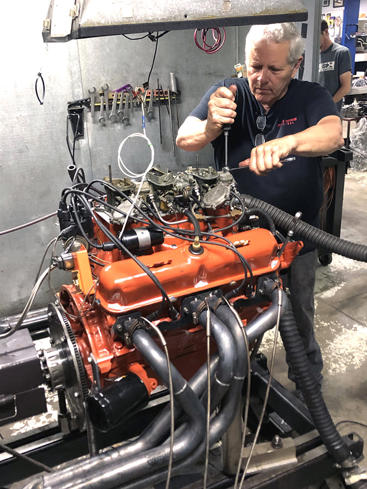 26 Mopar 340 Six Pack engine on dyno with headers and spark plug wires routed cleanly