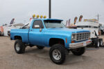 27 1979 Chevrolet K10 lifted with smiley KC lights wide off road tires and classic blue paint