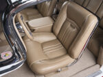 27 Custom bucket seats in the 1959 Chevy Impala with integrated armrest and billet seat adjustment trim