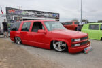 30 1999 Chevrolet Tahoe two door in fire red slammed on large chrome 5 spokes with smoothed bodylines