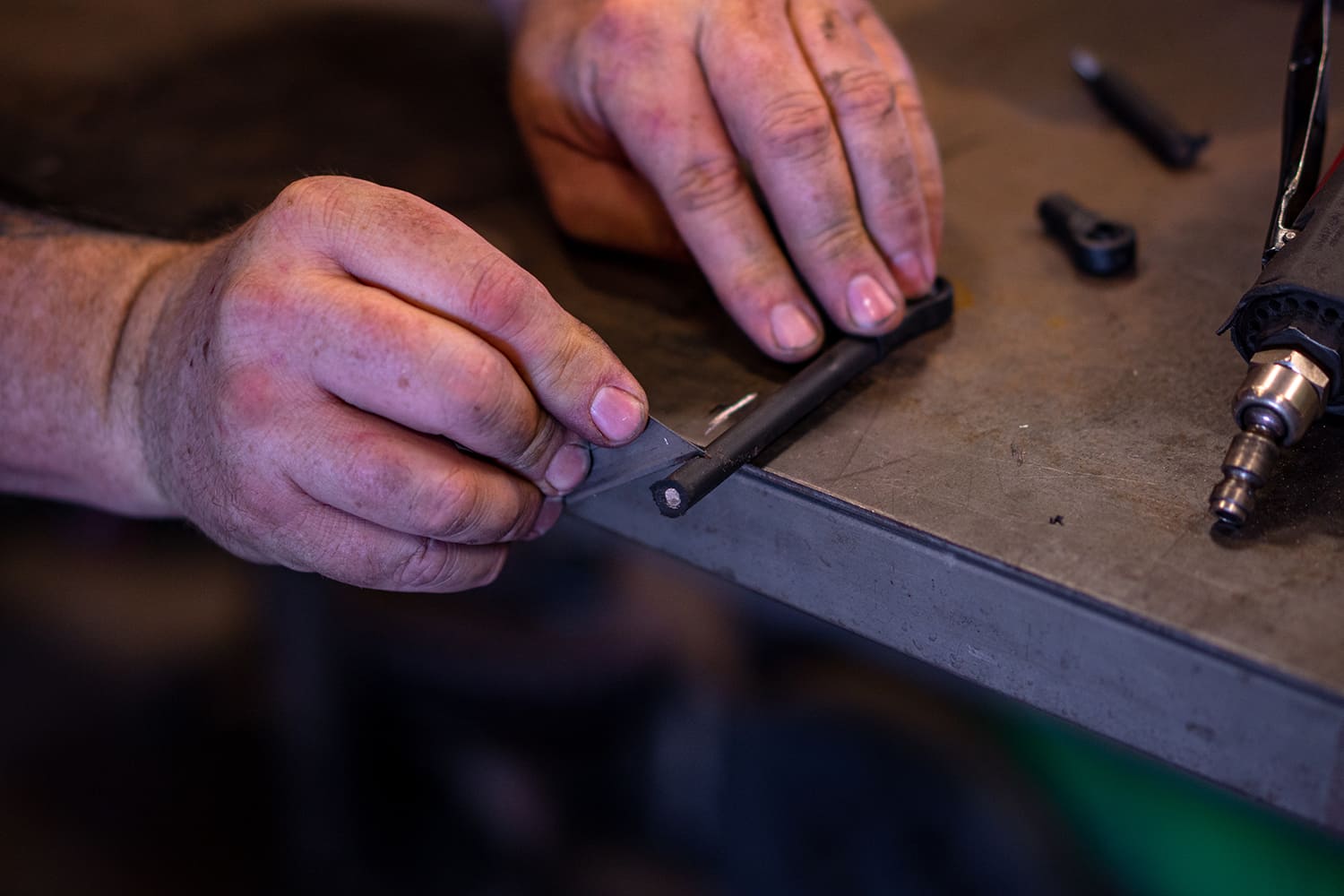 30 Deburring the trimmed sensor link rod to prep it for final install