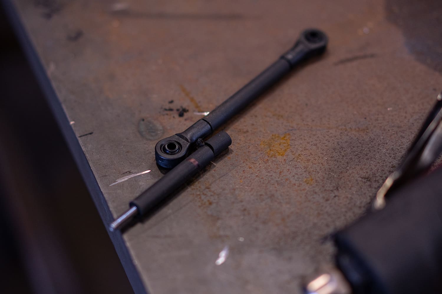 31 Cut and sized AccuAir sensor rods laid out with rod ends ready for linkage