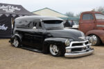 32 1954 Chevrolet 3100 panel truck in gloss black shaved trim and tucked polished 5 spoke wheels