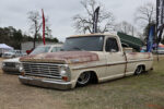 34 1969 Ford F 100 in patina cream and rust finish laid out on deep dish chrome wheels