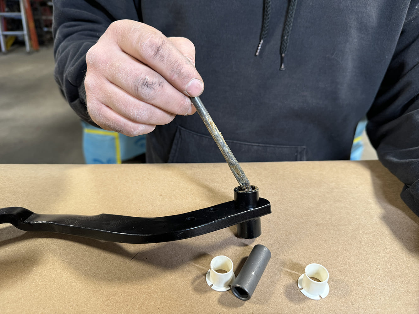003 1971 Camaro pedal assembly being lubricated during interior installation