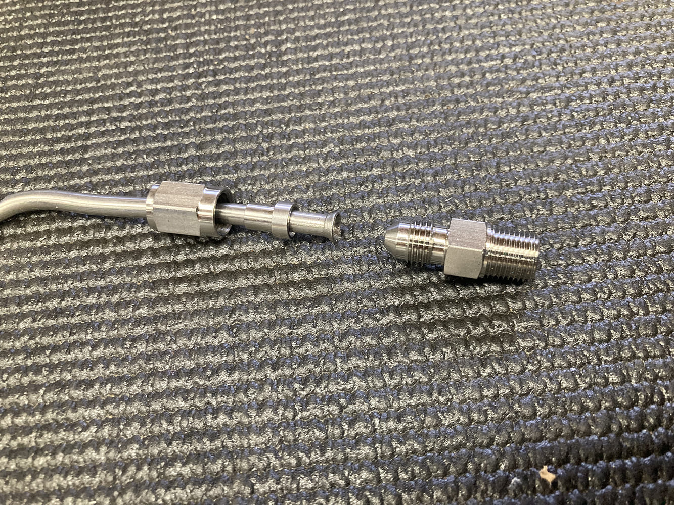 006 Stainless brake line components staged for final assembly before tightening