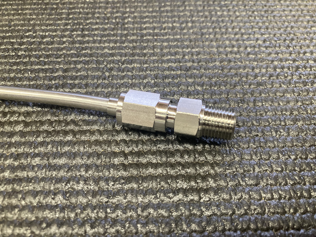 007 AN brake line fitting fully assembled on precision bent stainless tubing
