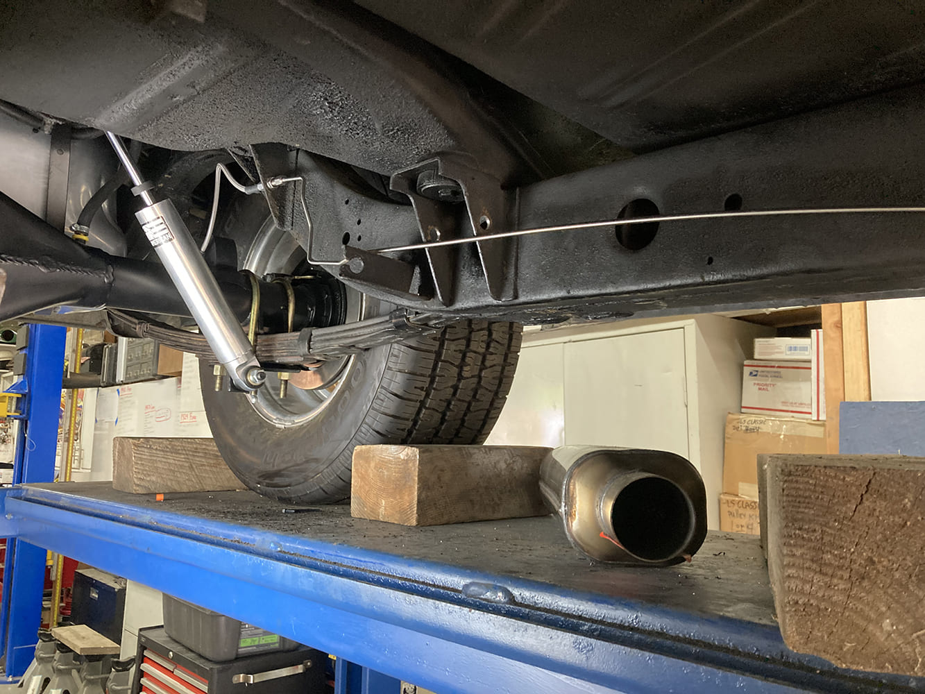 018 Stainless brake line routed cleanly along the frame rail on a lift