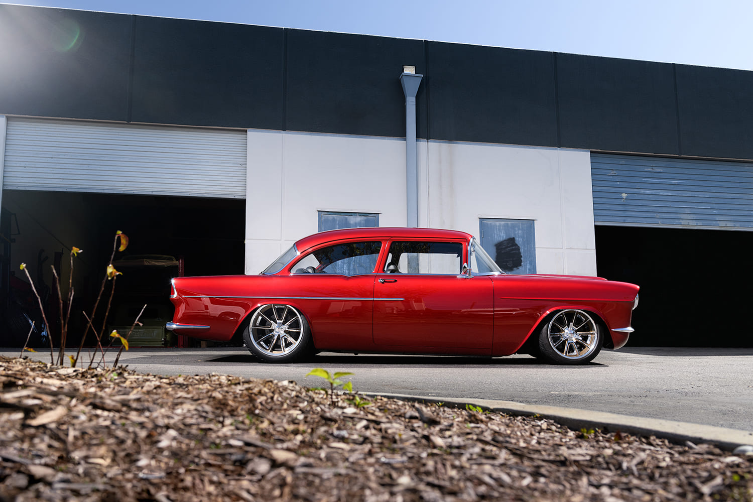 02 1955 Chevy Custom side profile shows chopped roof flush glass and tucked bumpers