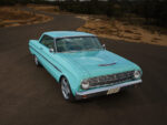 02 1963 Ford Falcon front angle showing clean grille hood ornament and white interior