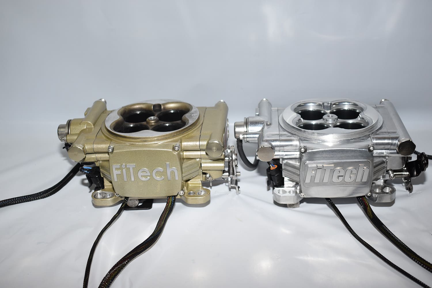 02 Side by side comparison of matte gold and polished aluminum FiTech EFI throttle bodies