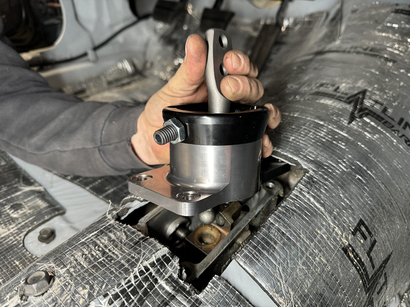 021 1971 Camaro billet short throw shifter being placed on TREMEC transmission
