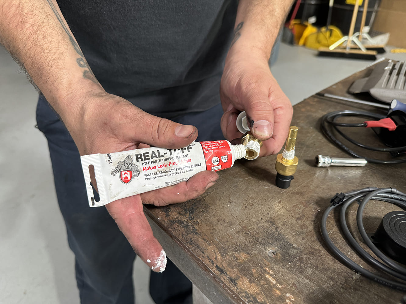 027 real tuff thread sealant applied to sensor adapter fitting