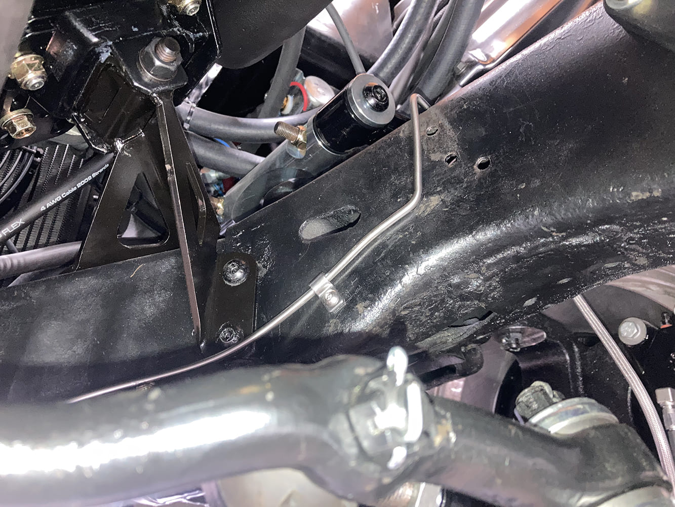 029 Final front brake hardline curves around suspension mount clean and tight install