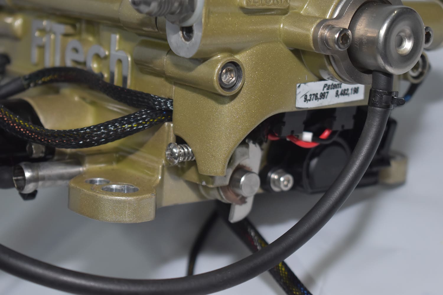 03 Close up of FiTech throttle linkage and wiring harness on gold anodized EFI unit