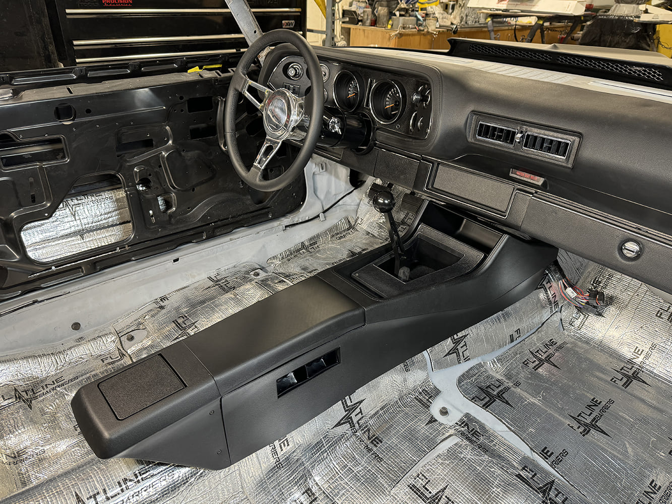 032 1971 Camaro interior nearly complete with dash console and shifter mounted over Flatline insulation