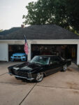 06 1965 Buick Riviera billet wheels garage backdrop American flag scene